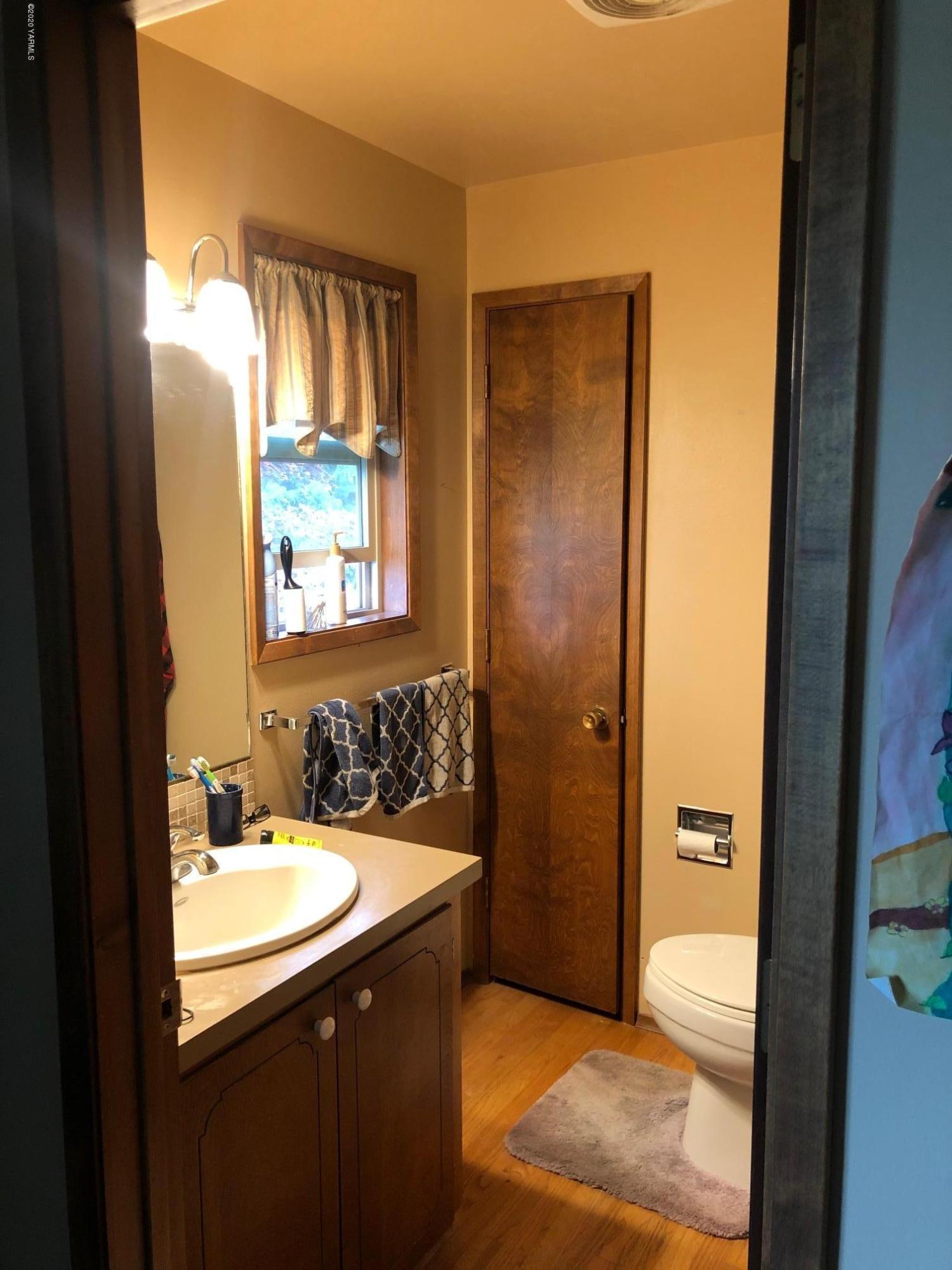 170 St Mary Road Harrah, WA 98933 - Photo 25 of 26 a bathroom with a granite countertop sink toilet and shower