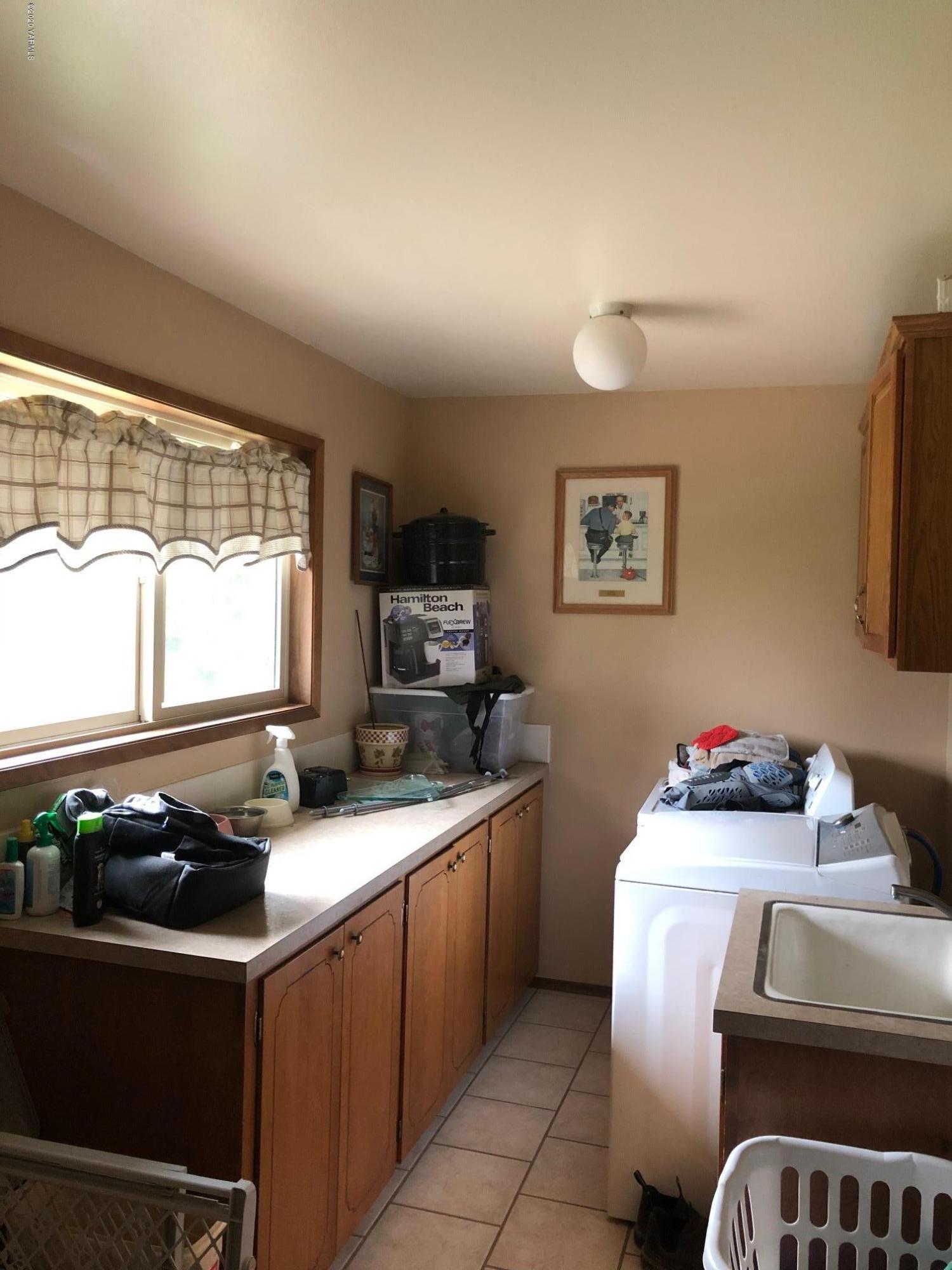 170 St Mary Road Harrah, WA 98933 - Photo 26 of 26 a kitchen with a sink stove and window