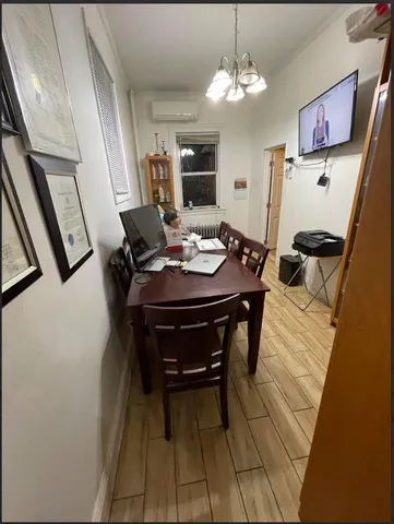 a dining room with furniture and window