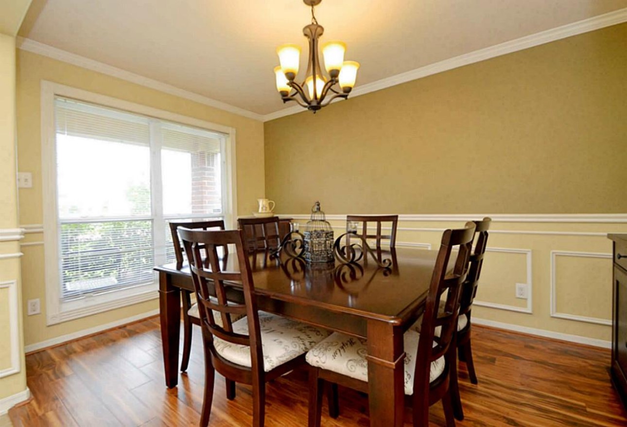 20606 Ricewood Village Trail Katy, TX 77449 - Photo 4 of 17 a view of a dining room with furniture and wooden floor