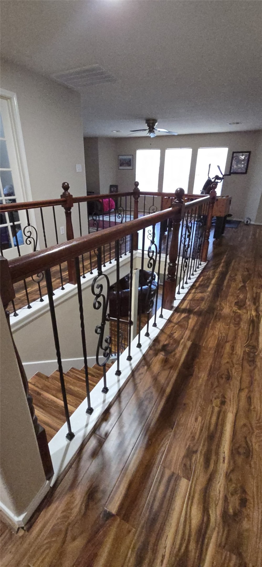 20606 Ricewood Village Trail Katy, TX 77449 - Photo 8 of 17 a view of a hallway with wooden floor