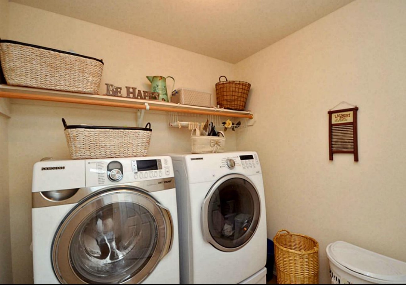 20606 Ricewood Village Trail Katy, TX 77449 - Photo 10 of 17 a utility room with dryer and washer