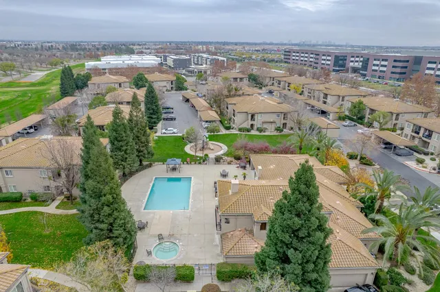 an aerial view of a house with outdoor space lake view