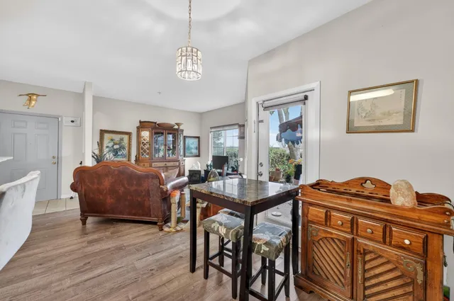 a view of a dining room with furniture window and wooden floor