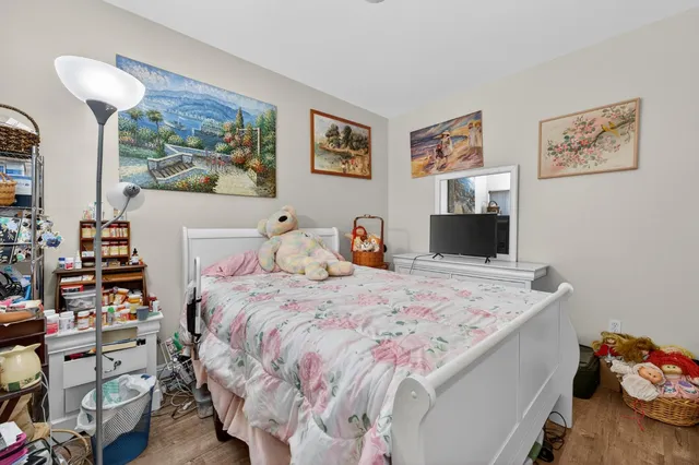 a bedroom with a bed and furniture