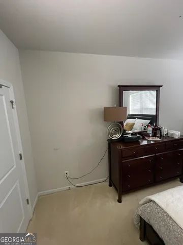 a bathroom with a sink a toilet a mirror and shower