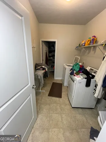 a room with furniture and wooden floor