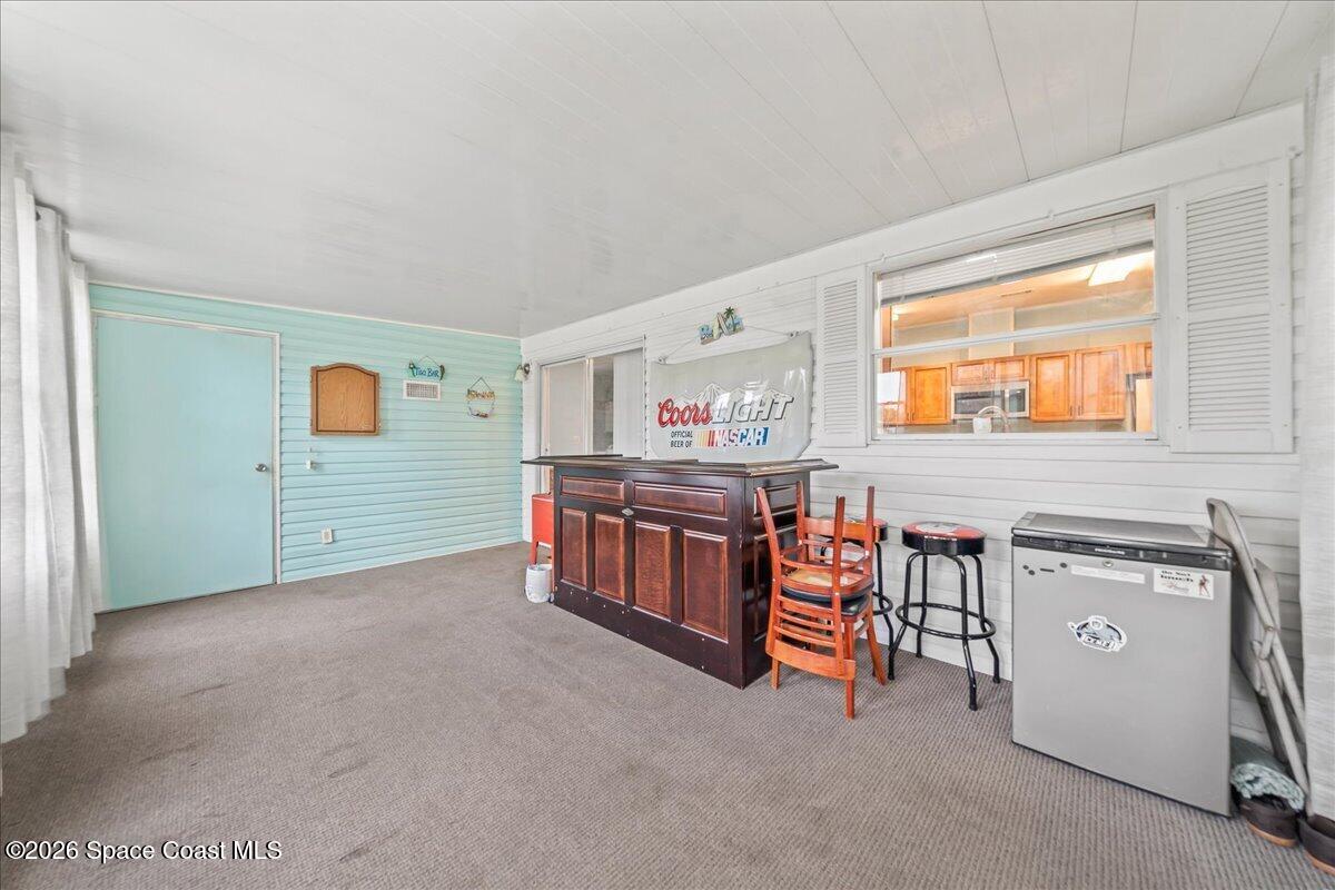 7628 Boxelder Road Micco, FL 32976 - Photo 22 of 30 Florida Room & Storage Unit