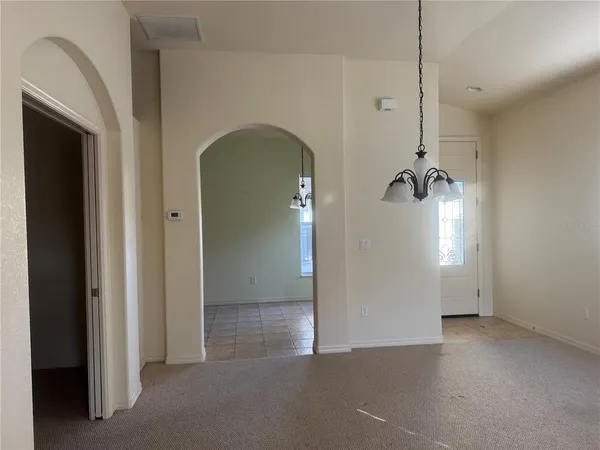 a view of empty room with windows