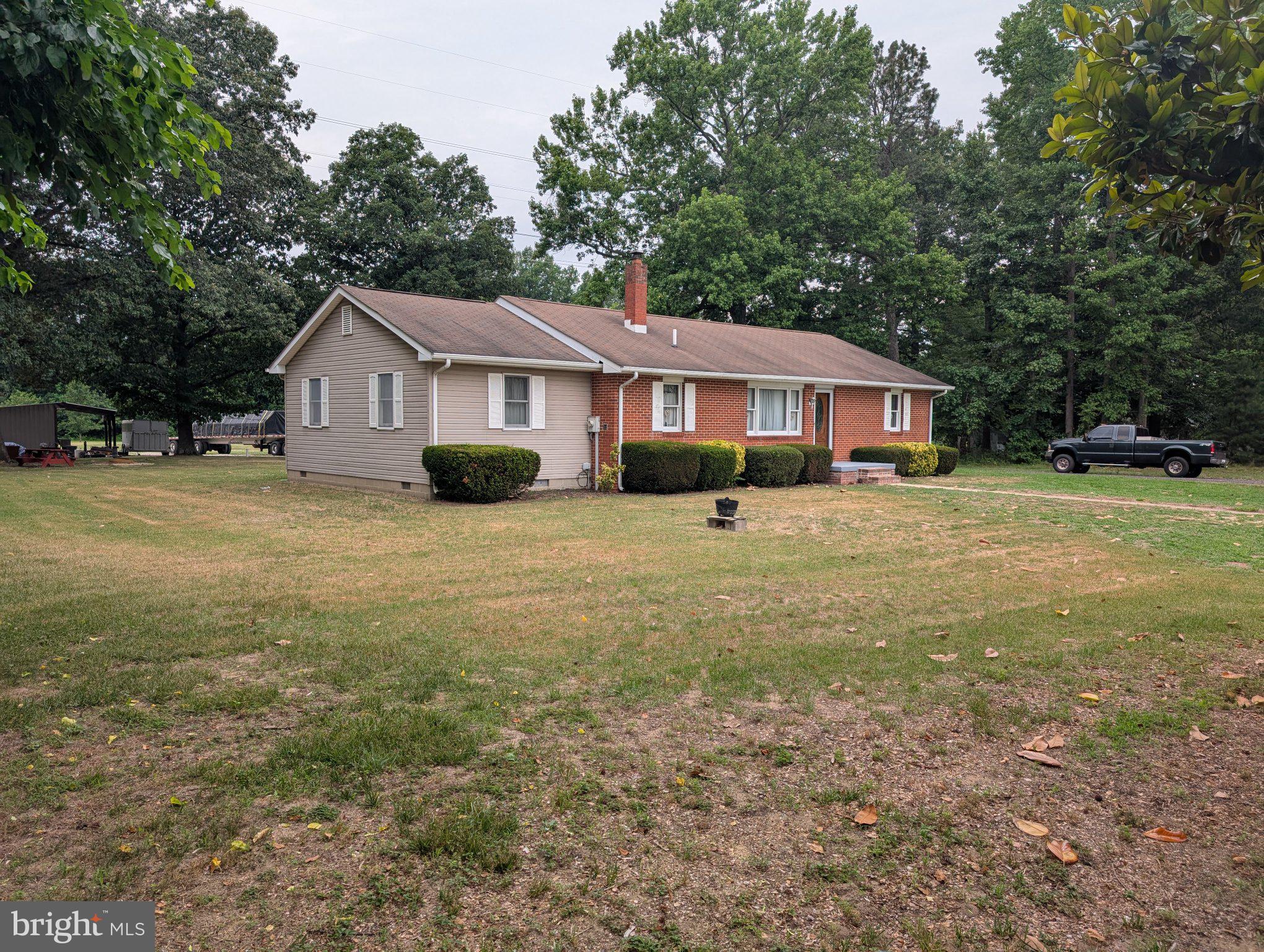 13790 Drapers Mill Road Greensboro, MD 21639 - Photo 2 of 22 Charming home nestled in nature's embrace.