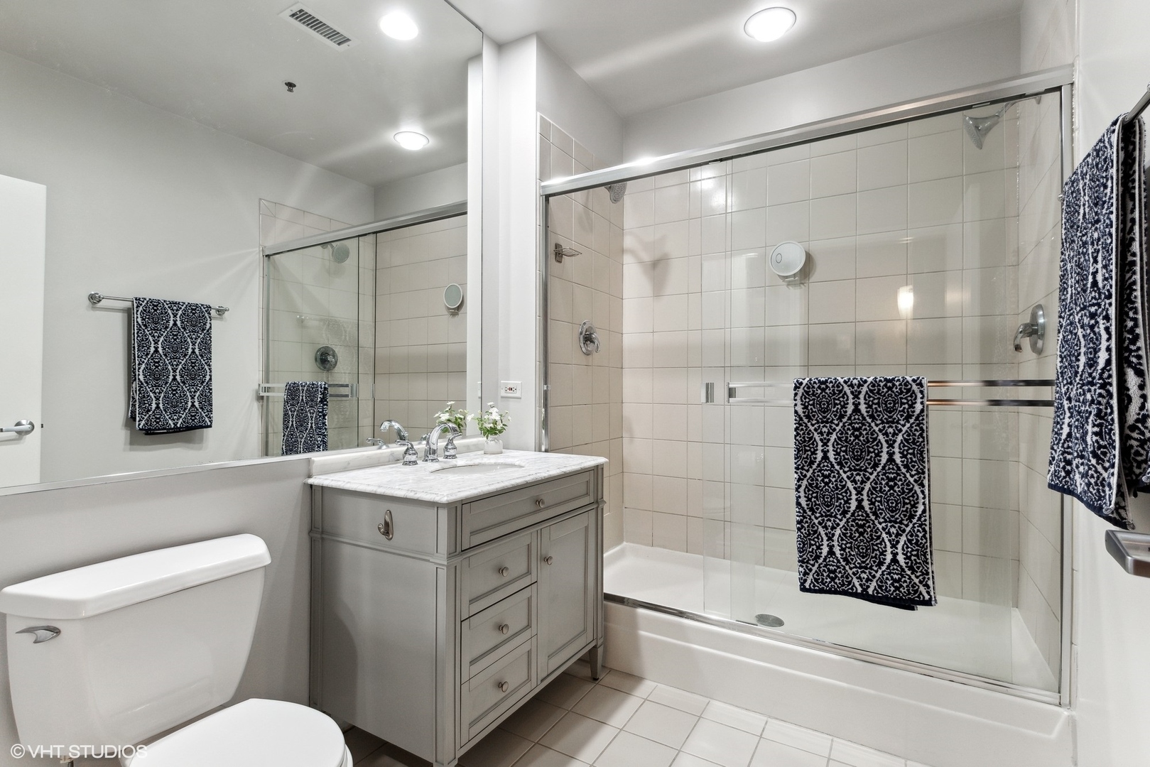 1301 West Madison Street, Unit 603 Chicago, IL 60607 - Photo 14 of 24 a bathroom with a sink a toilet and shower
