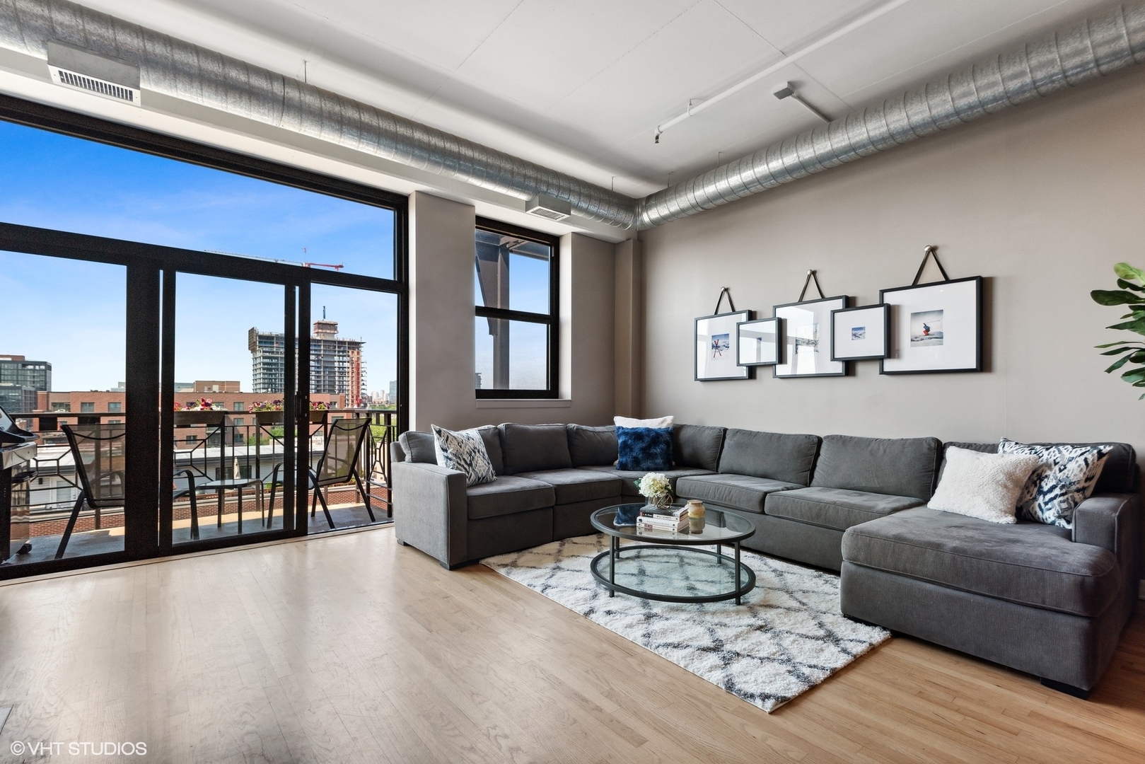 1301 West Madison Street, Unit 603 Chicago, IL 60607 - Photo 3 of 24 a living room with furniture and a large window