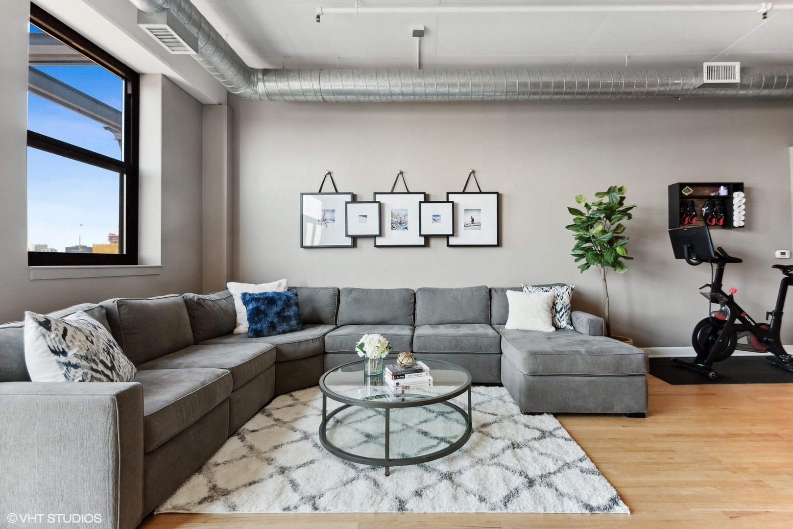 1301 West Madison Street, Unit 603 Chicago, IL 60607 - Photo 5 of 24 a living room with furniture and a white wall