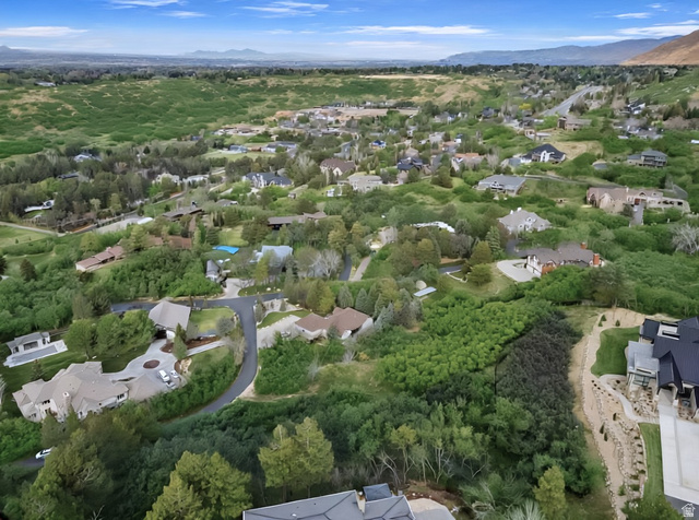 10667 Hidden Ridge Lane Sandy, UT 84092 - Photo 7 of 21 Aerial view of residential area featuring a mountainous background