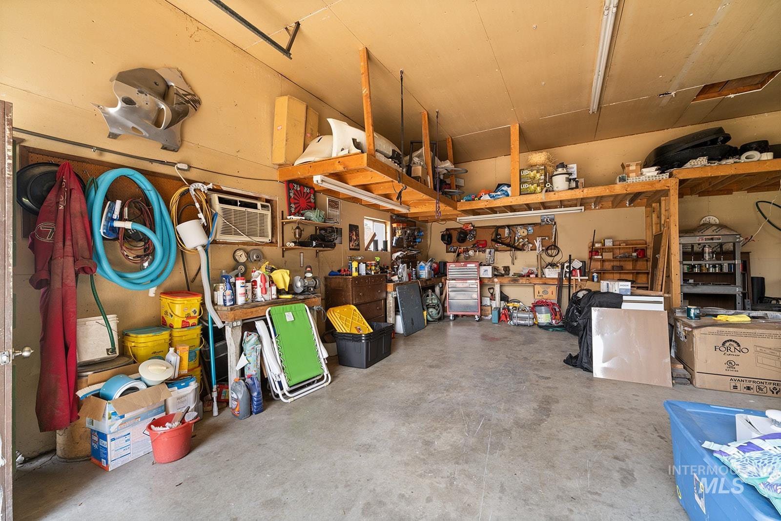 2007 Ripon Avenue Lewiston, ID 83501 - Photo 22 of 30 Spacious garage featuring concrete flooring and built-in overhead storage shelving