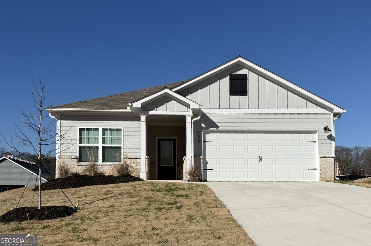 115 Darter Court Hoschton, GA 30548 - Photo 1 of 8 a view of a house with garage