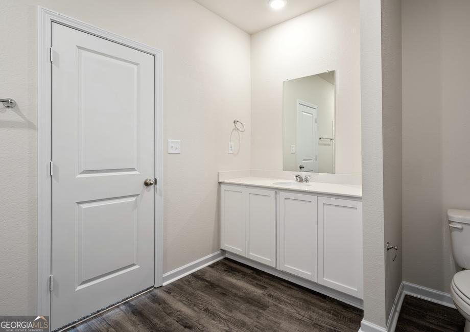 115 Darter Court Hoschton, GA 30548 - Photo 6 of 8 a bathroom with a sink and a mirror