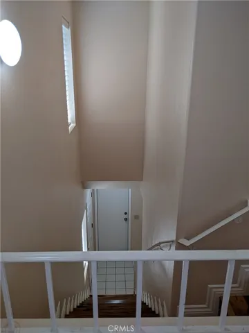 a view of room with window and wooden floor