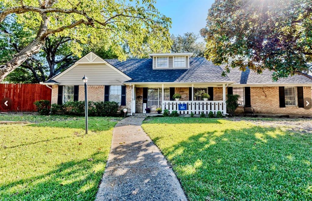Beautiful Brick House featuring covered porch