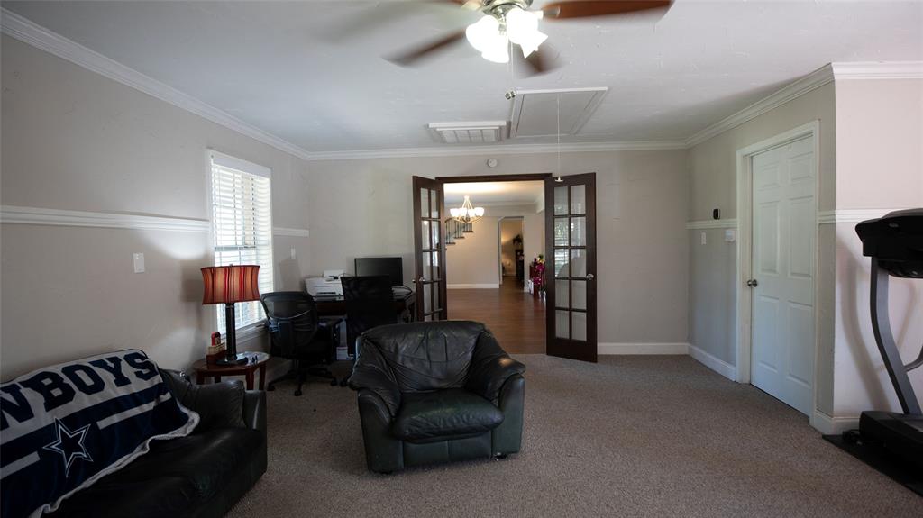 2888 Reedcroft Drive Farmers Branch, TX 75234 - Photo 12 of 32 a living room with furniture and a chandelier