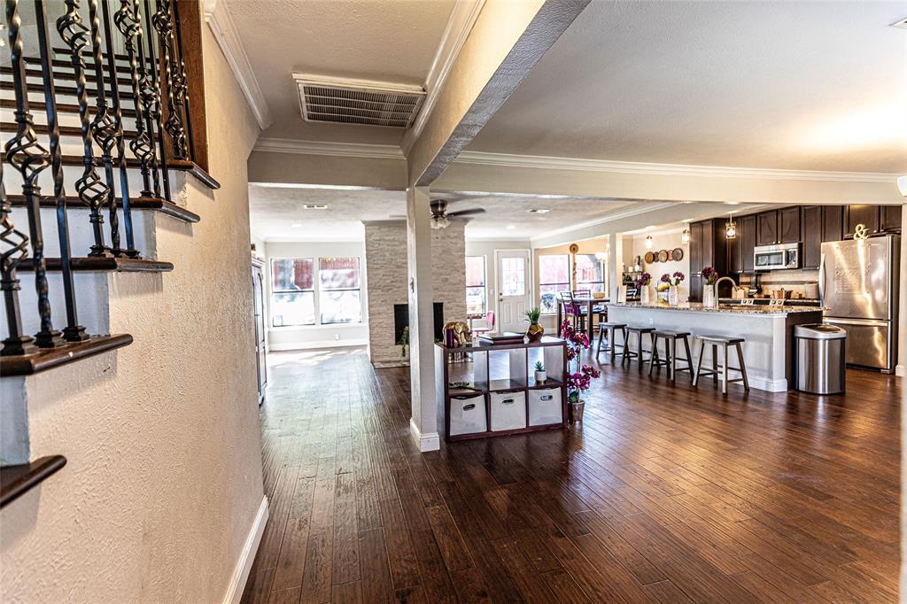 2888 Reedcroft Drive Farmers Branch, TX 75234 - Photo 22 of 32 Hall featuring ornamental molding, cooling unit, dark wood-type flooring, plenty of natural light, and stairway