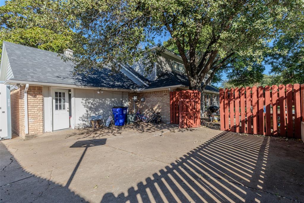 2888 Reedcroft Drive Farmers Branch, TX 75234 - Photo 23 of 32 a view of a patio with table and chairs a barbeque with wooden fence and floor