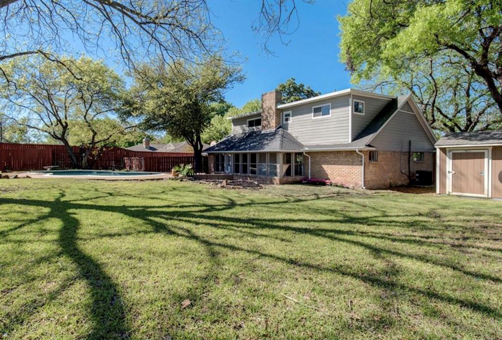 2888 Reedcroft Drive Farmers Branch, TX 75234 - Photo 4 of 32 a front view of a house with a garden