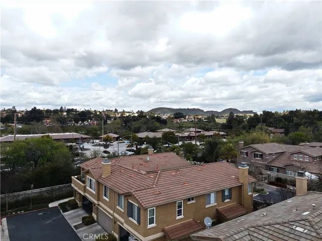 an aerial view of a house with a lot of trees