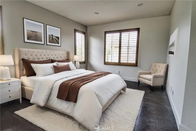 a bedroom with a bed and a couch