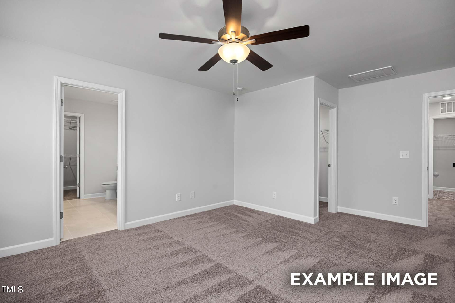 802 Rollingwheel Road Mebane, NC 27302 - Photo 13 of 40 an empty room with fan and a ceiling fan