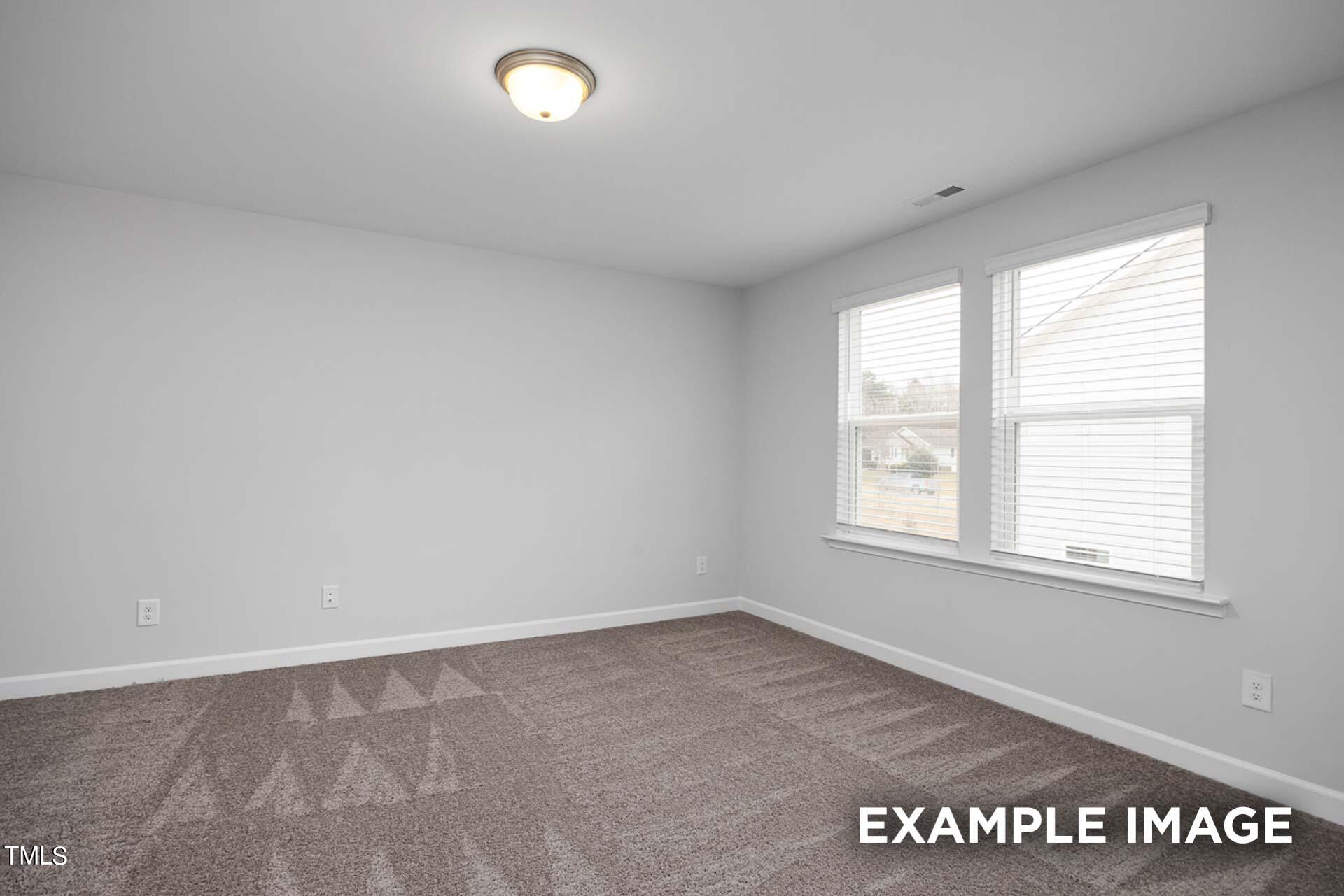 802 Rollingwheel Road Mebane, NC 27302 - Photo 19 of 40 an empty room with a window