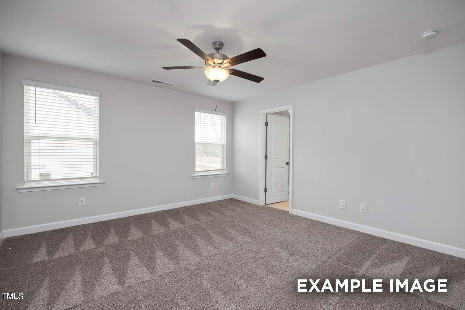 802 Rollingwheel Road Mebane, NC 27302 - Photo 20 of 40 a view of an empty room with a window