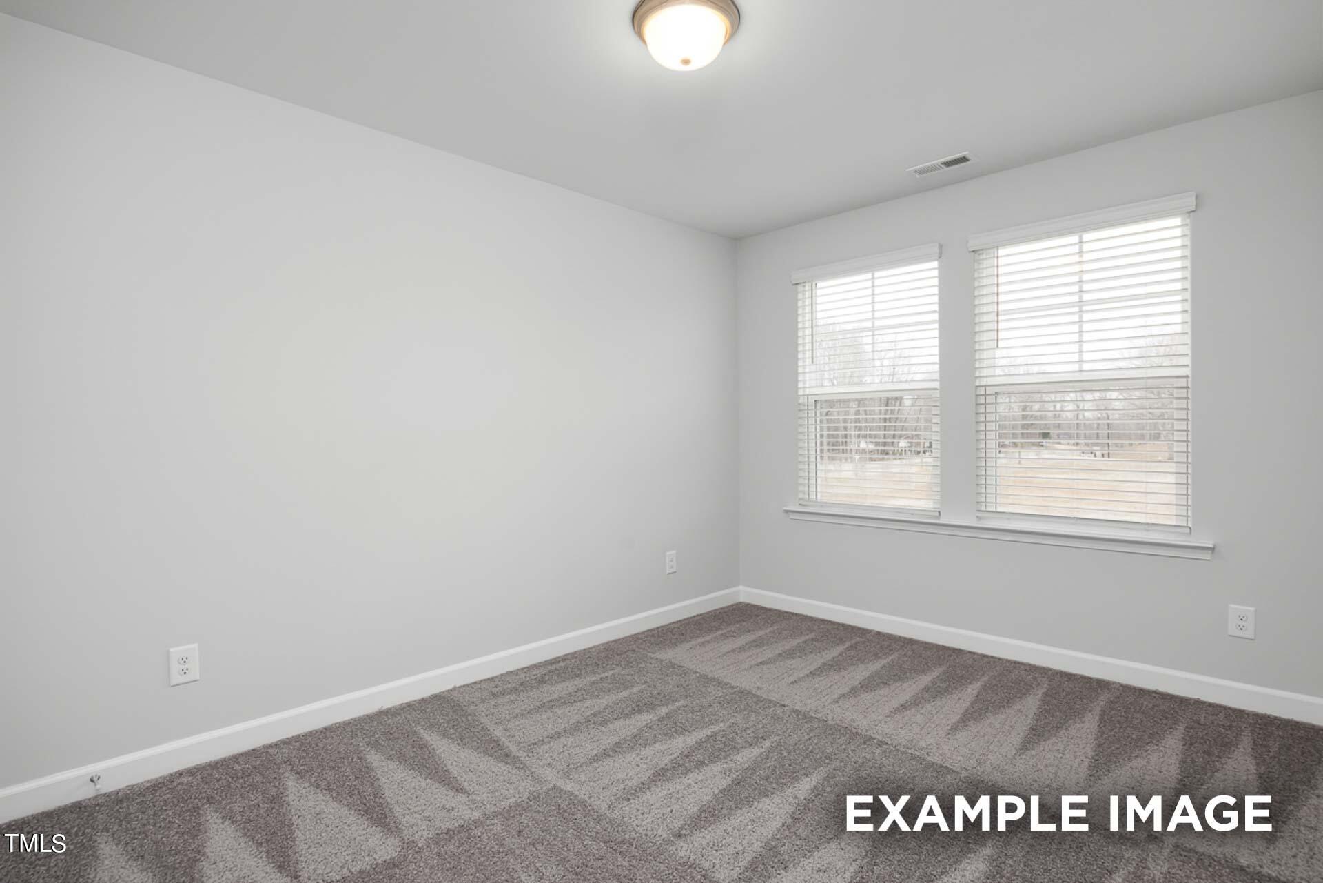 802 Rollingwheel Road Mebane, NC 27302 - Photo 22 of 40 an empty room with a window