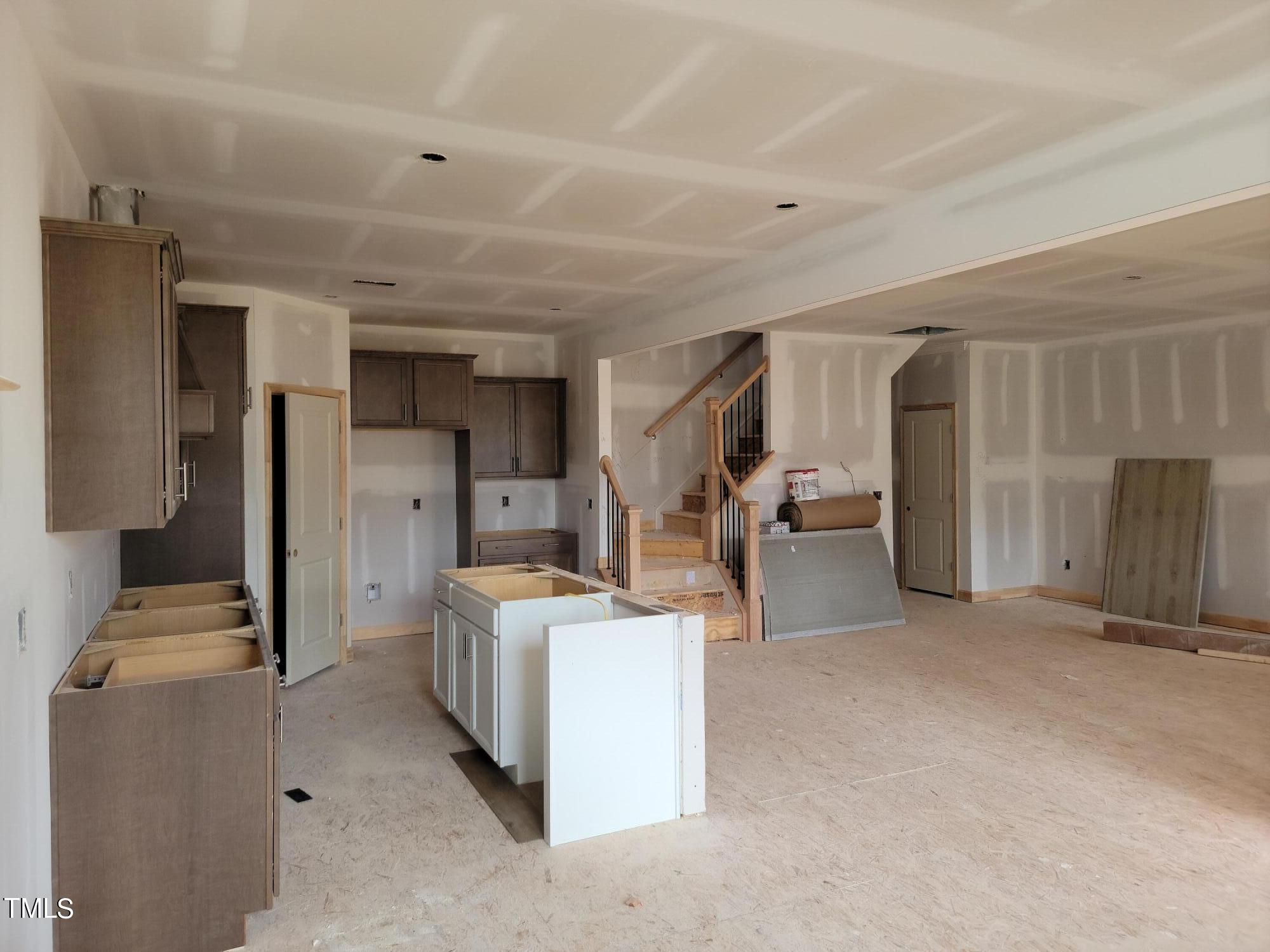 802 Rollingwheel Road Mebane, NC 27302 - Photo 30 of 40 a view of a kitchen with fridge and workspace