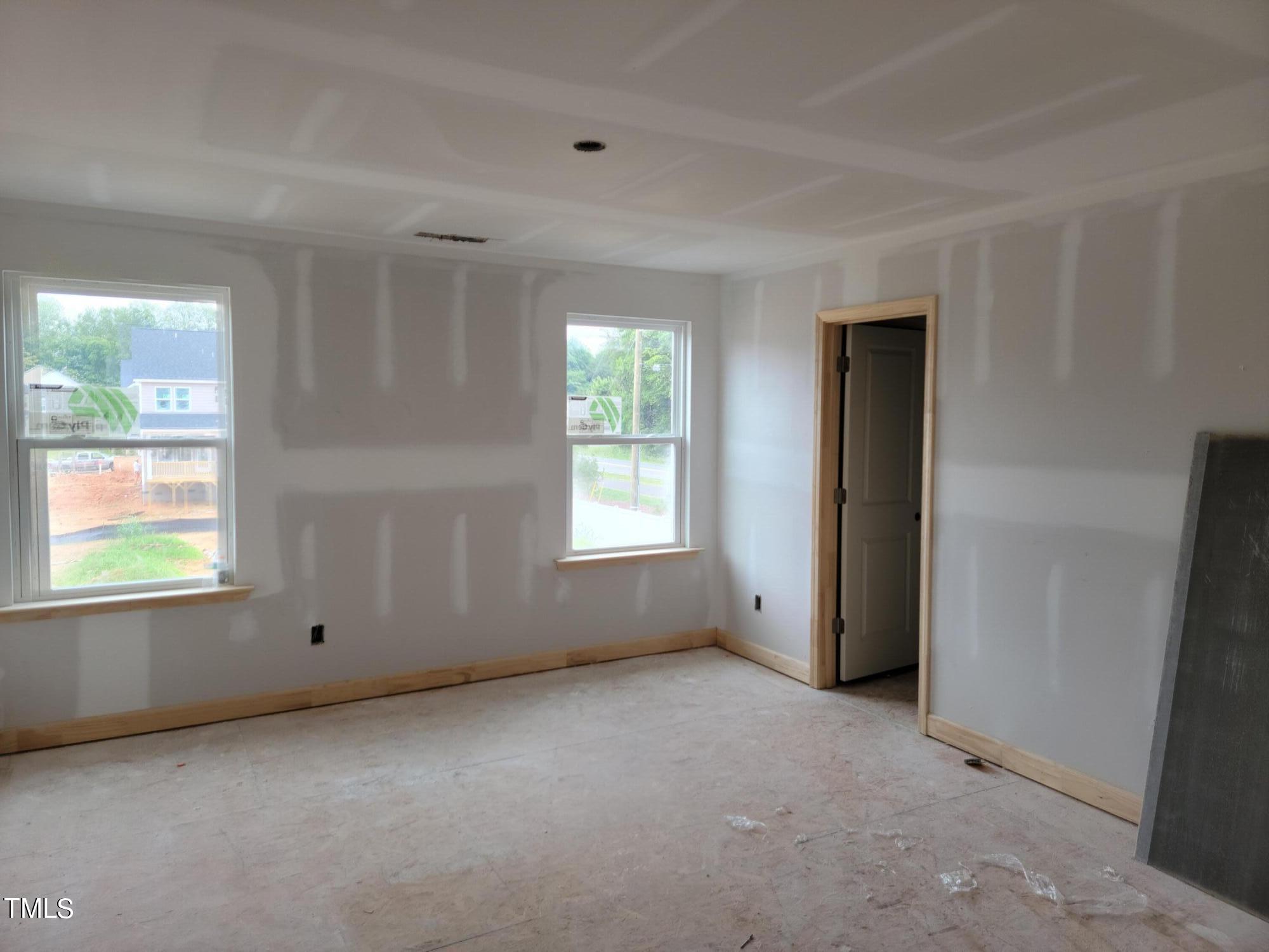 802 Rollingwheel Road Mebane, NC 27302 - Photo 32 of 40 an empty room with windows