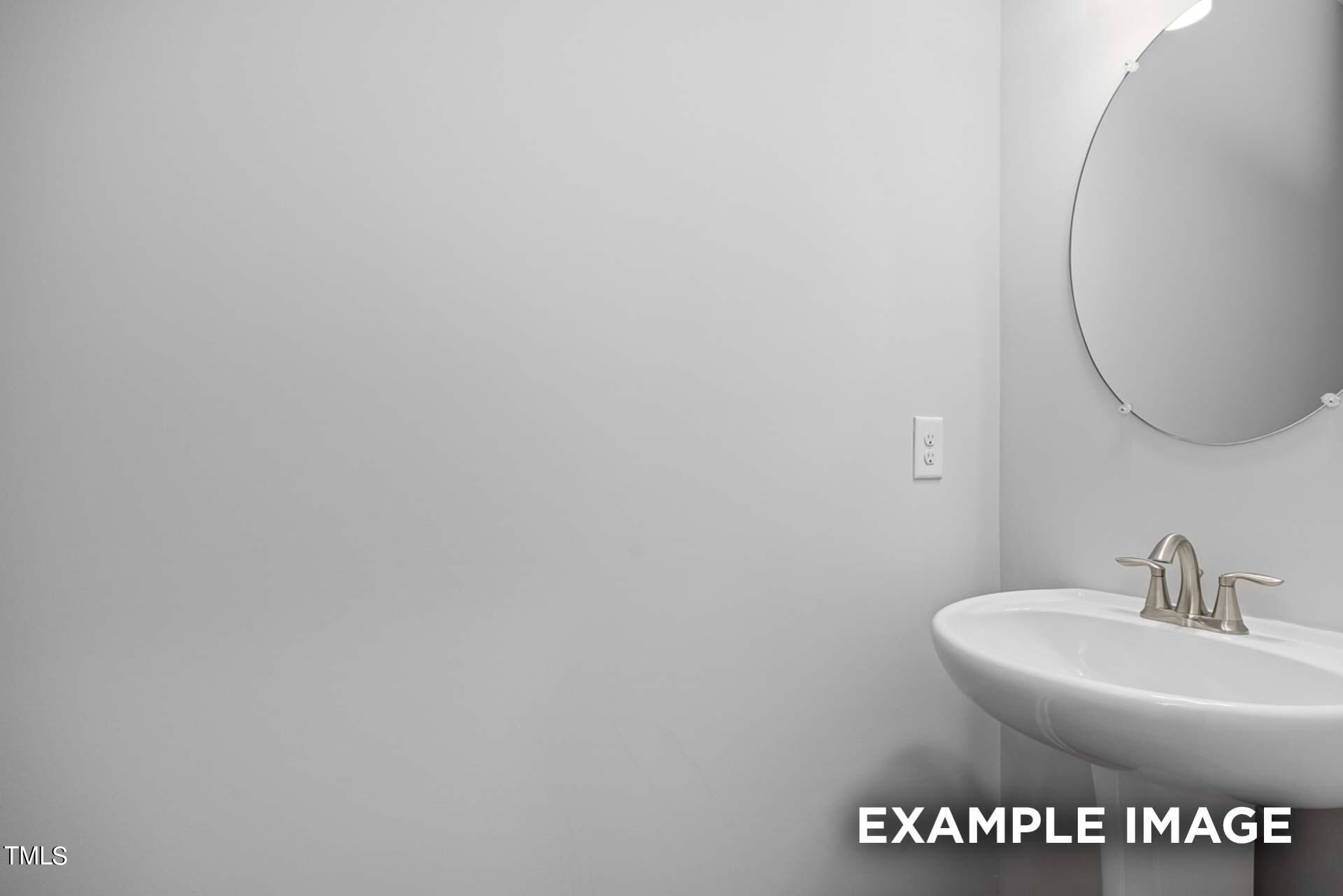 802 Rollingwheel Road Mebane, NC 27302 - Photo 6 of 40 a bathroom with a sink and a mirror