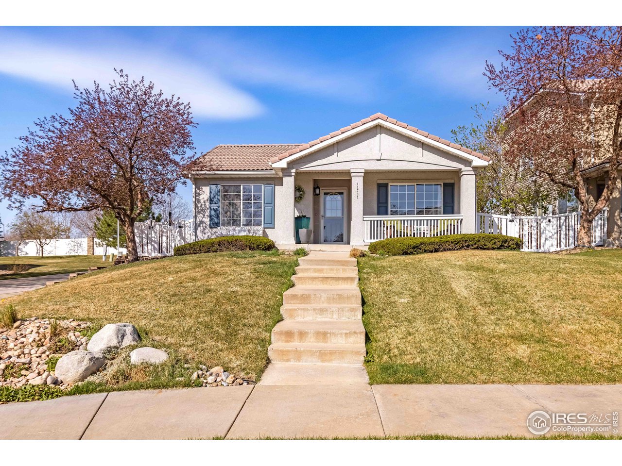 11737 Zenobia Loop Westminster, CO 80031 - Photo 1 of 39 a front view of a house with a yard