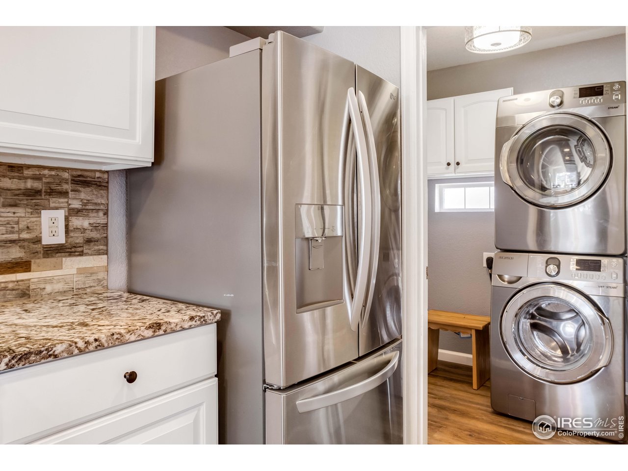 11737 Zenobia Loop Westminster, CO 80031 - Photo 15 of 39 a kitchen with stainless steel appliances granite countertop a refrigerator and a stove