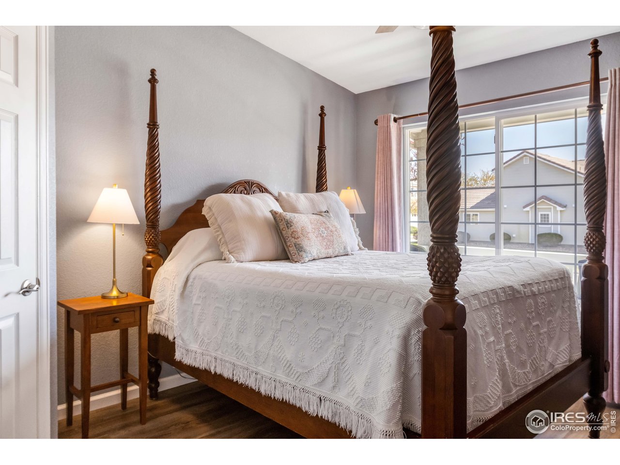11737 Zenobia Loop Westminster, CO 80031 - Photo 17 of 39 a bedroom with a bed and a large window