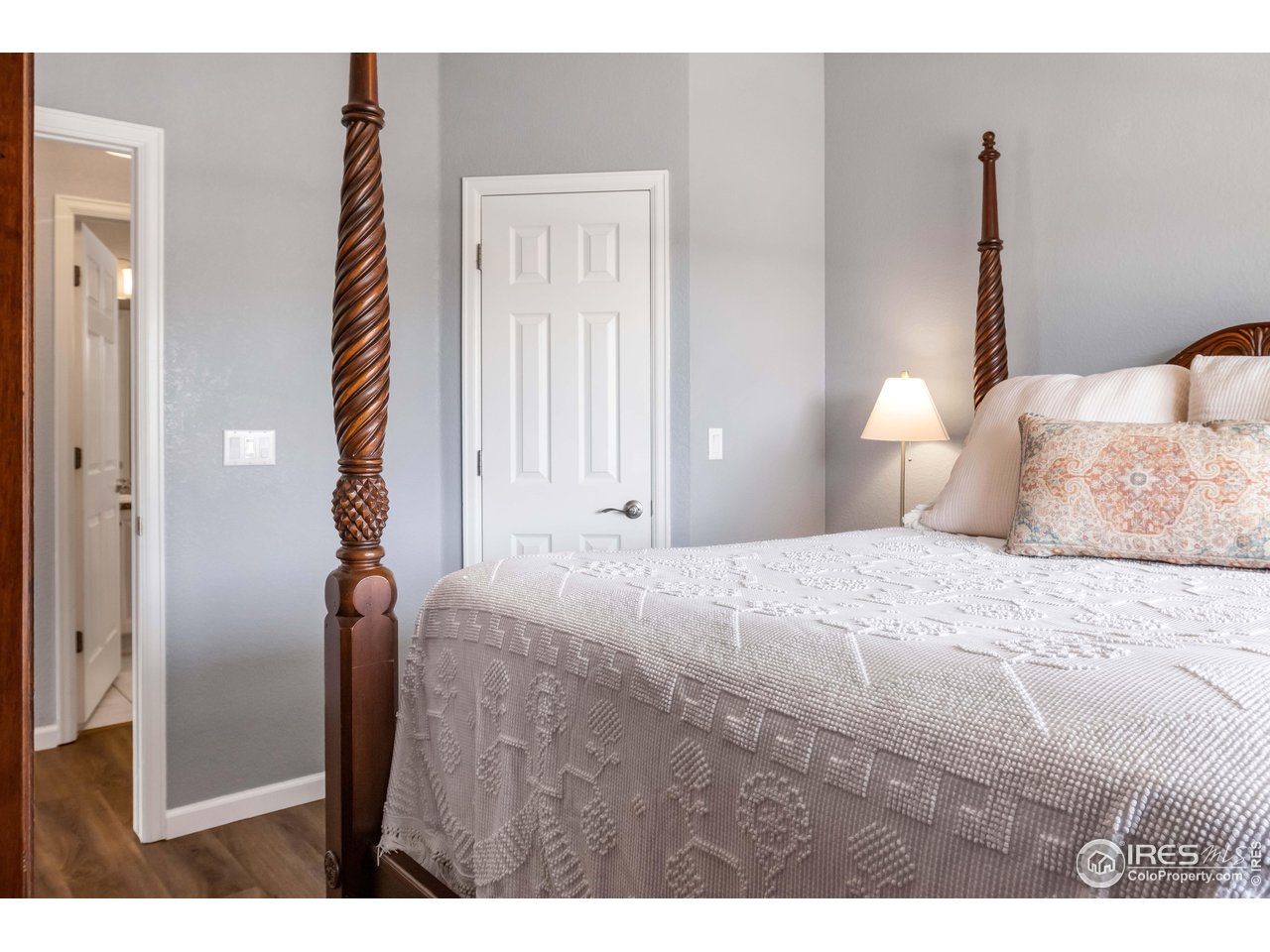 11737 Zenobia Loop Westminster, CO 80031 - Photo 18 of 39 a bedroom with a bed and a night stand