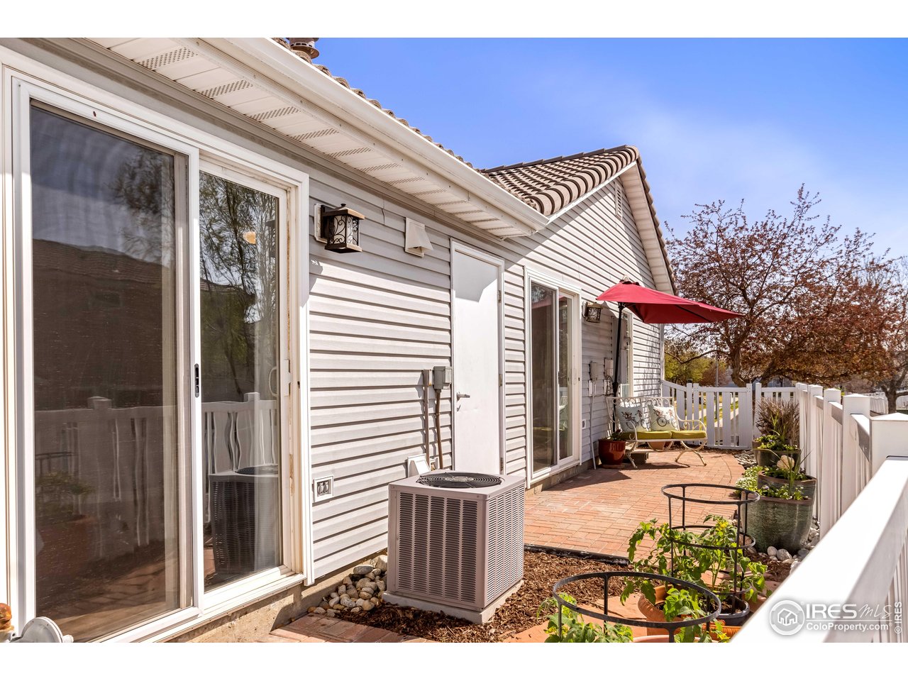 11737 Zenobia Loop Westminster, CO 80031 - Photo 22 of 39 a front view of a house with a outdoor space