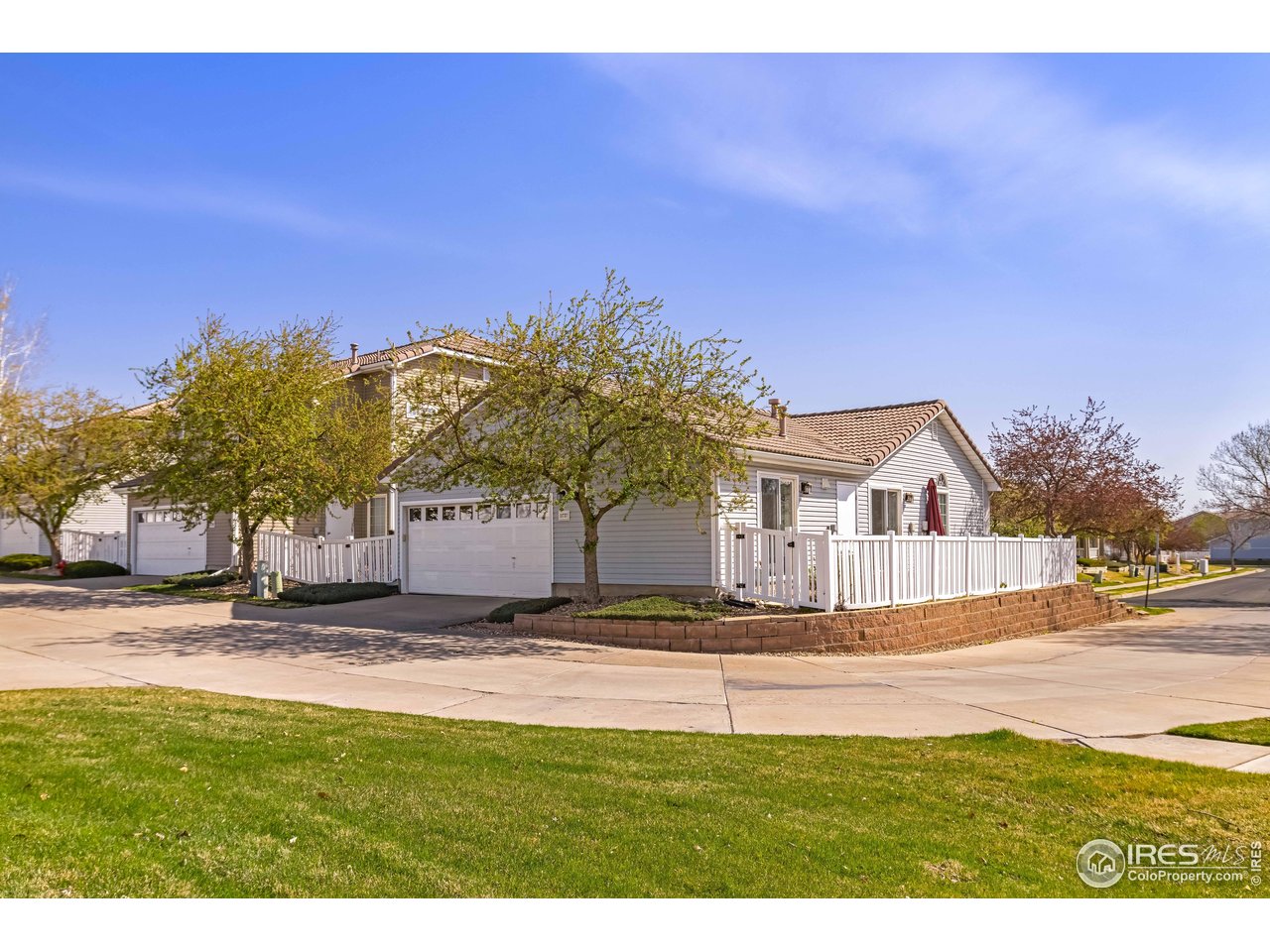 11737 Zenobia Loop Westminster, CO 80031 - Photo 27 of 39 a front view of a house with a yard
