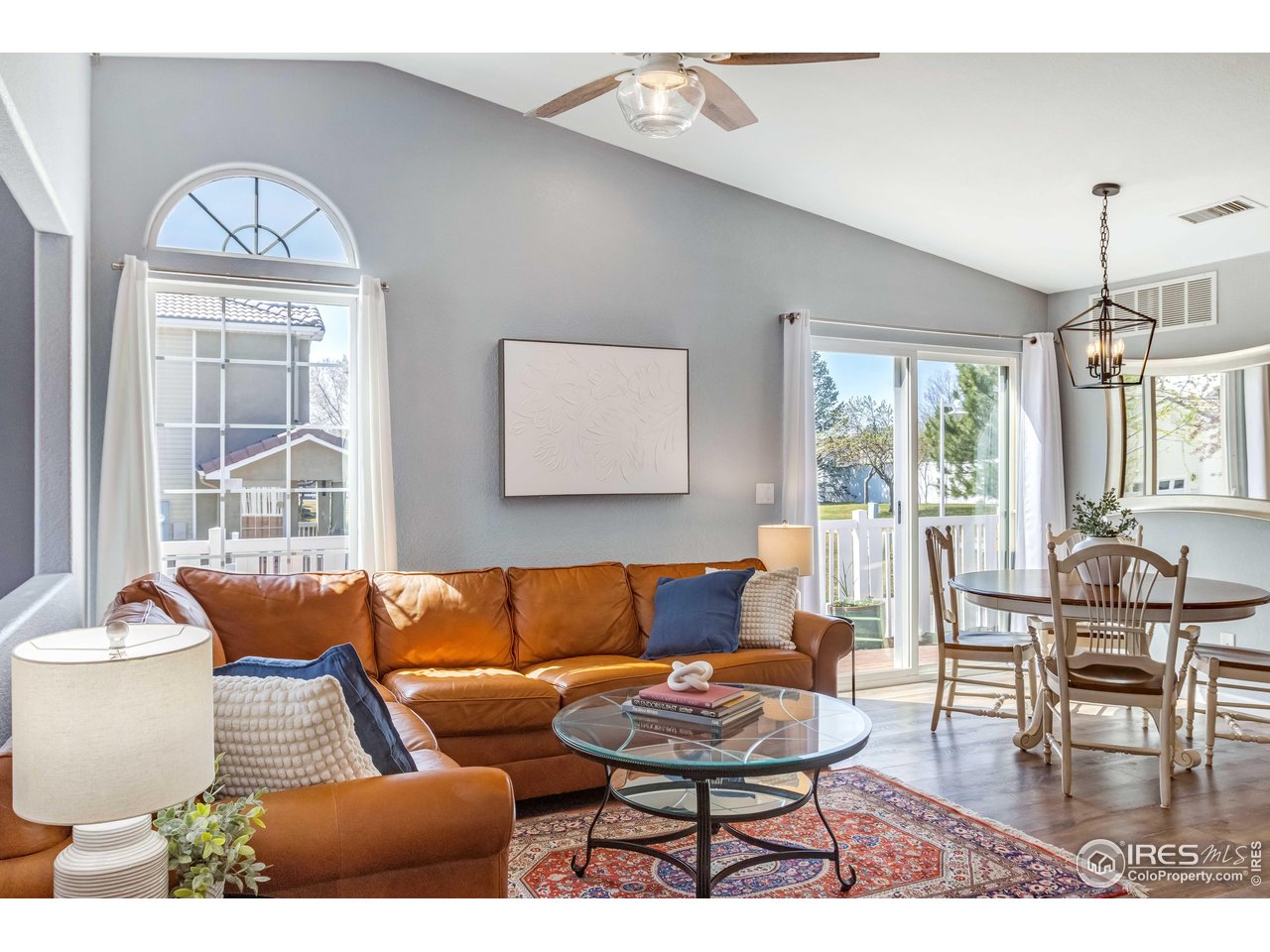 11737 Zenobia Loop Westminster, CO 80031 - Photo 7 of 39 a living room with furniture and a large window