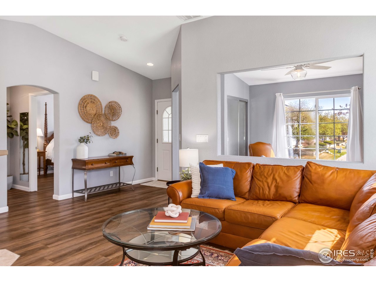 11737 Zenobia Loop Westminster, CO 80031 - Photo 8 of 39 a living room with furniture and wooden floor