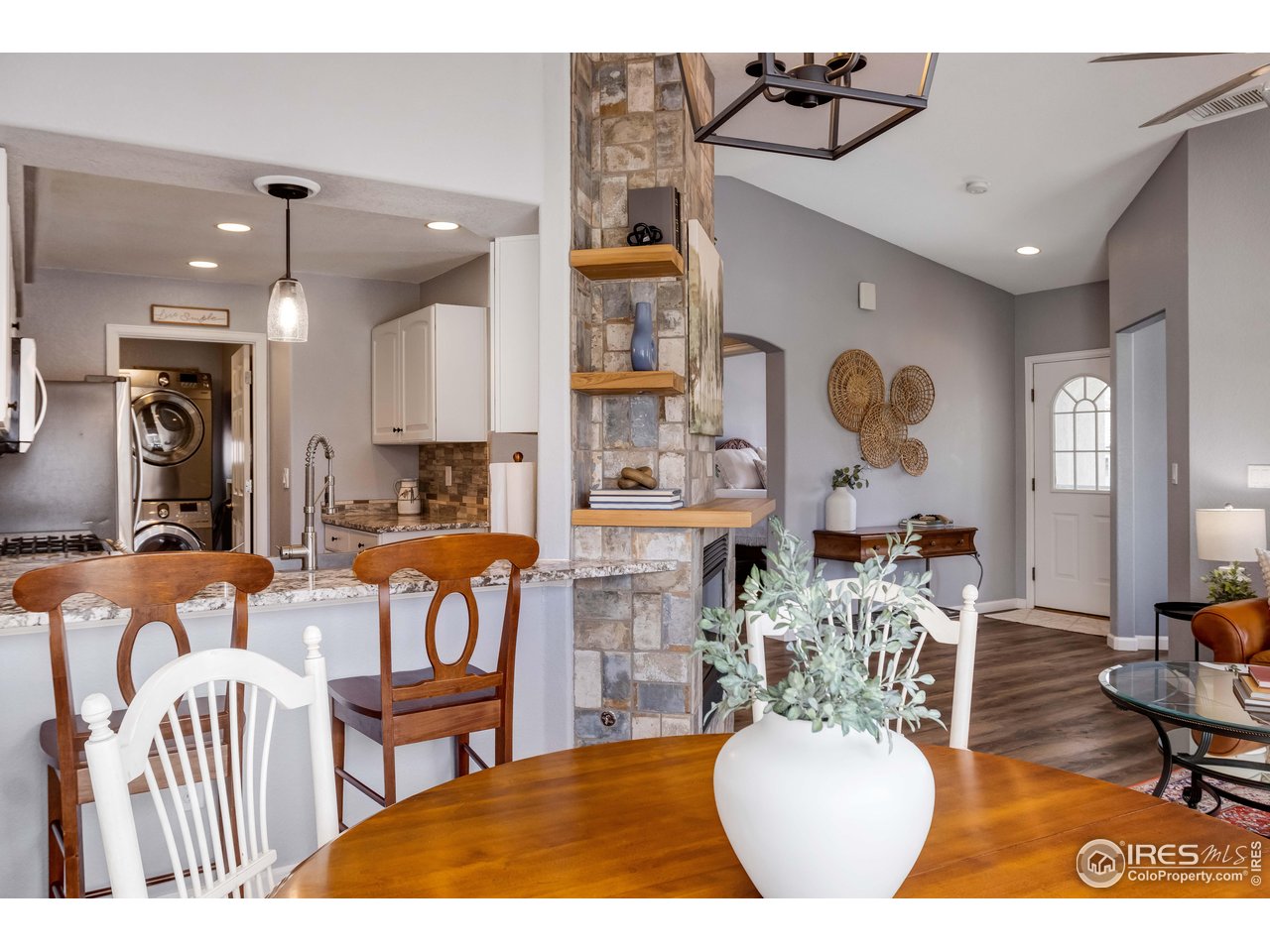 11737 Zenobia Loop Westminster, CO 80031 - Photo 9 of 39 a living room with furniture a rug and white walls