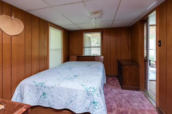 a bedroom with a bed and a dresser