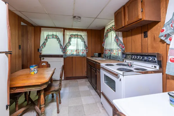 a kitchen with a stove a sink and a refrigerator