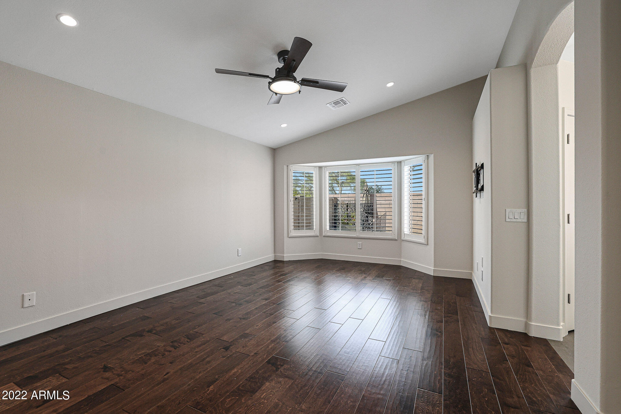 4316 East Rowel Road Phoenix, AZ 85050 - Photo 15 of 40 wooden floor in an empty room with a window