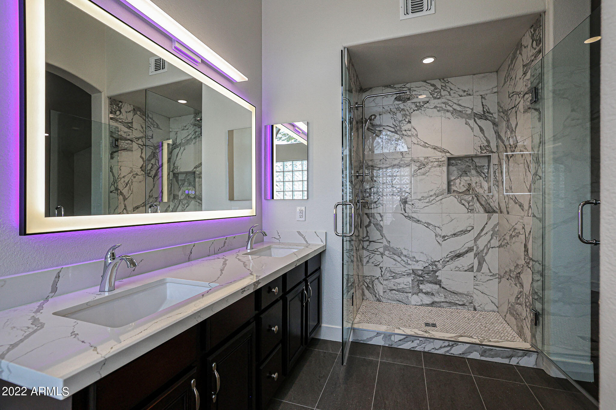 4316 East Rowel Road Phoenix, AZ 85050 - Photo 21 of 40 a bathroom with a double vanity sink mirror and shower