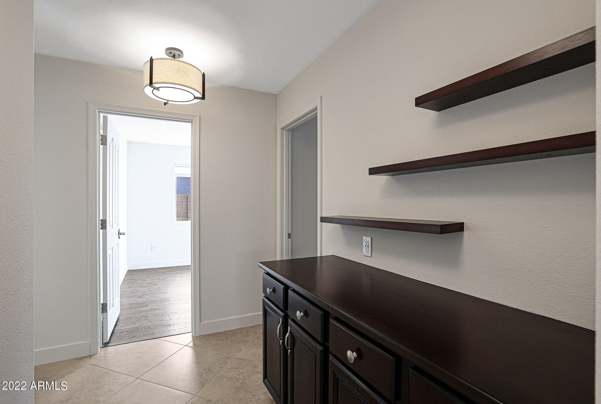 4316 East Rowel Road Phoenix, AZ 85050 - Photo 23 of 40 a kitchen with a refrigerator and a sink